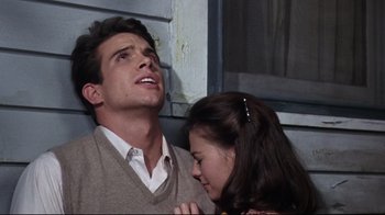 Movie still from “Splendor in the Grass” (1961), directed by Elia Kazan – A man and a woman looking up at one another; Close Up shot, Low angle