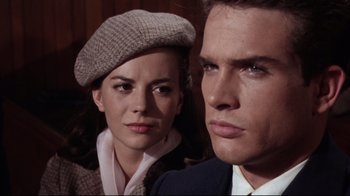 Movie still from “Splendor in the Grass” (1961), directed by Elia Kazan – A man and a woman standing next to each other; Close Up shot, Low angle