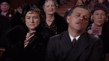 Movie still from “Splendor in the Grass” (1961), directed by Elia Kazan – An older man and a woman in a crowd of people; Close Up shot, Low angle