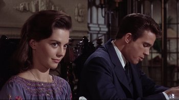 Movie still from “Splendor in the Grass” (1961), directed by Elia Kazan – A woman and a man sitting in front of each other; Close Up shot, Over the shoulder angle