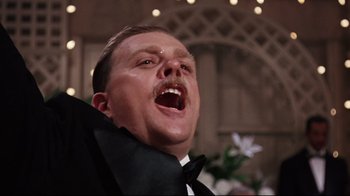 Movie still from “Splendor in the Grass” (1961), directed by Elia Kazan – A person wearing a suit and tie; Close Up shot, Low angle