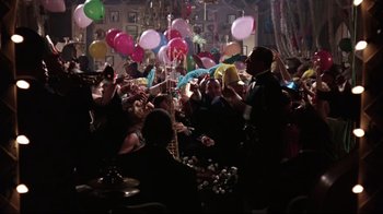 Movie still from “Splendor in the Grass” (1961), directed by Elia Kazan – A group of people in a room with balloons; Wide shot, Overhead angle