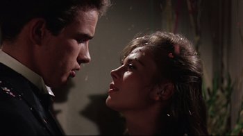 Movie still from “Splendor in the Grass” (1961), directed by Elia Kazan – A man and a woman face to face in a dark room; Close Up shot, Over the shoulder angle