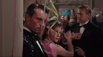 Movie still from “Splendor in the Grass” (1961), directed by Elia Kazan – A group of people standing around each other at a party; Close Up shot, Low angle