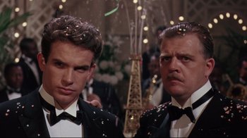 Movie still from “Splendor in the Grass” (1961), directed by Elia Kazan – A couple of men standing next to each other in tuxedos; Close Up shot, Low angle