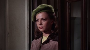 Movie still from “Splendor in the Grass” (1961), directed by Elia Kazan – A young woman wearing a green hat and a brown coat; Close Up shot, Low angle