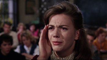 Movie still from “Splendor in the Grass” (1961), directed by Elia Kazan – A person holding her hand up to her head; Close Up shot, High angle