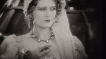 Movie still from “Splendor in the Grass” (1961), directed by Elia Kazan – An old photo of a woman wearing a veil; Close Up shot, Low angle