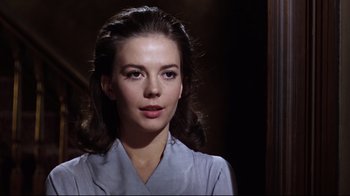 Movie still from “Splendor in the Grass” (1961), directed by Elia Kazan – A beautiful woman with long dark hair wearing a blue shirt; Close Up shot, Low angle