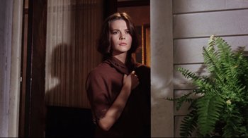 Movie still from “Splendor in the Grass” (1961), directed by Elia Kazan – A woman standing next to a wall in a room; Medium shot, Low angle
