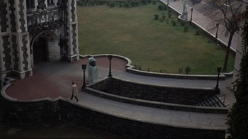 Movie still from “Splendor in the Grass” (1961), directed by Elia Kazan – A man walking down the steps of an old building; Extreme Wide shot, High angle