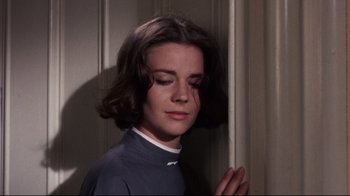 Movie still from “Splendor in the Grass” (1961), directed by Elia Kazan – A young woman with her eyes closed and her hands folded in front of her face; Close Up shot, Low angle