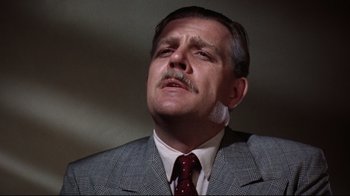 Movie still from “Splendor in the Grass” (1961), directed by Elia Kazan – A person wearing a suit and tie; Close Up shot, Low angle
