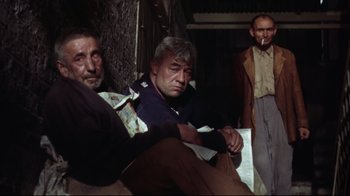 Movie still from “Splendor in the Grass” (1961), directed by Elia Kazan – A group of men sitting next to each other on a couch; Medium shot, Low angle