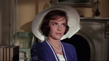 Movie still from “Splendor in the Grass” (1961), directed by Elia Kazan – A woman wearing a white hat and a blue jacket; Close Up shot, Low angle
