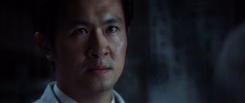 Movie still from “Spy Game” (2001), directed by Tony Scott – A man's face in a dimly - lit room; Close Up shot, Low angle