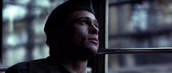 Movie still from “Spy Game” (2001), directed by Tony Scott – A man wearing a hat looking out of a window; Close Up shot, Low angle