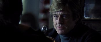 Movie still from “Spy Game” (2001), directed by Tony Scott – A person with a horn; Close Up shot, Over the shoulder angle