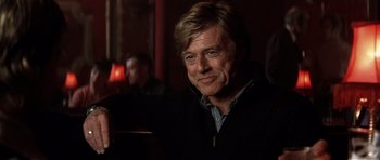 Movie still from “Spy Game” (2001), directed by Tony Scott – A person wearing a jacket; Close Up shot, Over the shoulder angle