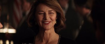 Movie still from “Spy Game” (2001), directed by Tony Scott – A person smiling for the camera; Close Up shot, Over the shoulder angle