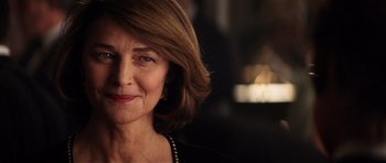 Movie still from “Spy Game” (2001), directed by Tony Scott – An older woman with short brown hair; Close Up shot, Over the shoulder angle