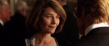 Movie still from “Spy Game” (2001), directed by Tony Scott – A person wearing a dress; Close Up shot, Over the shoulder angle