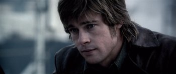 Movie still from “Spy Game” (2001), directed by Tony Scott – A person wearing a jacket; Close Up shot, Over the shoulder angle