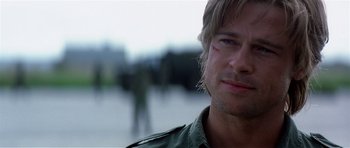 Movie still from “Spy Game” (2001), directed by Tony Scott – A person with a bruise on his face; Close Up shot, Over the shoulder angle