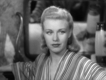 Movie still from “Stage Door” (1937), directed by Gregory La Cava – A black - and - white photo of a woman in a striped shirt; Close Up shot, High angle