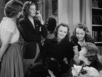 Movie still from “Stage Door” (1937), directed by Gregory La Cava – A black and white photo of a group of women sitting at a table; Medium shot, Low angle