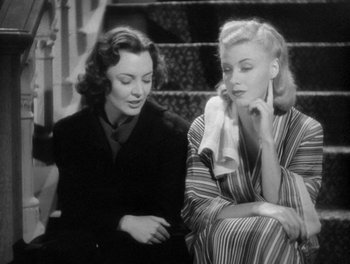 Movie still from “Stage Door” (1937), directed by Gregory La Cava – Two women sitting next to each other on stairs; Medium shot, Over the shoulder angle