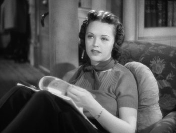 Movie still from “Stage Door” (1937), directed by Gregory La Cava – A black and white photo of a woman sitting in a chair; Close Up shot, High angle