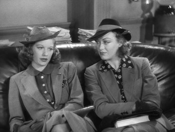 Movie still from “Stage Door” (1937), directed by Gregory La Cava – A couple of women sitting next to each other on top of a couch; Medium shot, Low angle