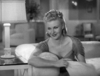 Movie still from “Stage Door” (1937), directed by Gregory La Cava – A black - and - white photo of a woman sitting on a couch; Close Up shot, High angle