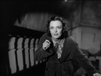 Movie still from “Stage Door” (1937), directed by Gregory La Cava – An old photo of a woman in a bathrobe; Medium shot, Low angle