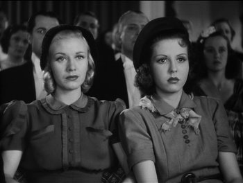 Movie still from “Stage Door” (1937), directed by Gregory La Cava – A couple of women sitting next to each other in a room; Close Up shot, Low angle