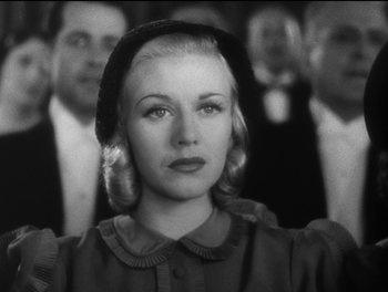 Movie still from “Stage Door” (1937), directed by Gregory La Cava – A black and white photo of a woman in a crowd; Close Up shot, Low angle