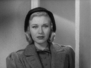 Movie still from “Stage Door” (1937), directed by Gregory La Cava – A black and white photo of a woman wearing a hat; Close Up shot, Over the shoulder angle
