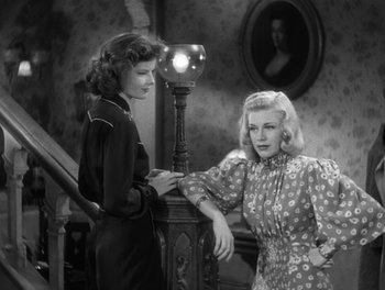 Movie still from “Stage Door” (1937), directed by Gregory La Cava – Two women standing next to each other near a lamp; Medium shot, Low angle