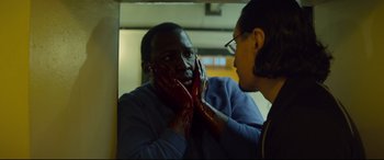 Movie still from “Starred Up” (2013), directed by David Mackenzie – A man with blood all over his face looking into a mirror; Close Up shot, Over the shoulder angle