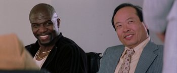 Movie still from “Starsky & Hutch” (2004), directed by Todd Phillips – Two men sitting next to each other in a room; Close Up shot, Over the shoulder angle