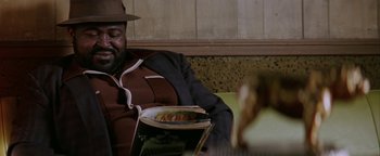 Movie still from “Starsky & Hutch” (2004), directed by Todd Phillips – A man sitting in front of a plate of food; Close Up shot, High angle