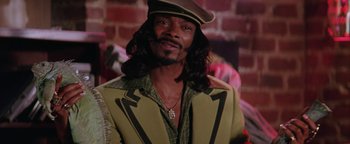 Movie still from “Starsky & Hutch” (2004), directed by Todd Phillips – A man with long black hair wearing a brown hat; Close Up shot, Low angle