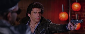 Movie still from “Starsky & Hutch” (2004), directed by Todd Phillips – A man that is wearing a leather jacket; Close Up shot, Over the shoulder angle