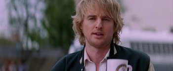 Movie still from “Starsky & Hutch” (2004), directed by Todd Phillips – A person with long blonde hair; Close Up shot, Over the shoulder angle