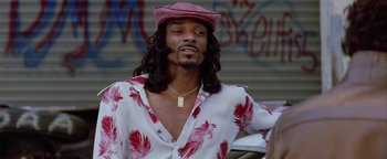 Movie still from “Starsky & Hutch” (2004), directed by Todd Phillips – A man with long black hair wearing a hat; Close Up shot, Low angle