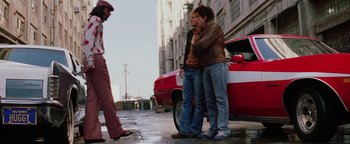 Movie still from “Starsky & Hutch” (2004), directed by Todd Phillips – A couple of people that are standing in the street; Wide shot, Low angle