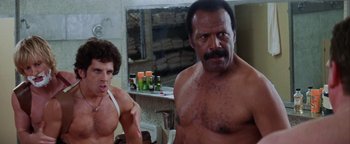 Movie still from “Starsky & Hutch” (2004), directed by Todd Phillips – A man and a woman in a bathroom with a mirror; Medium shot, Low angle