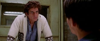 Movie still from “Starsky & Hutch” (2004), directed by Todd Phillips – A man looking at himself in the mirror in front of a mirror; Close Up shot, Over the shoulder angle