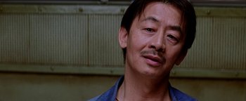 Movie still from “Starsky & Hutch” (2004), directed by Todd Phillips – A person wearing a blue shirt; Close Up shot, Low angle